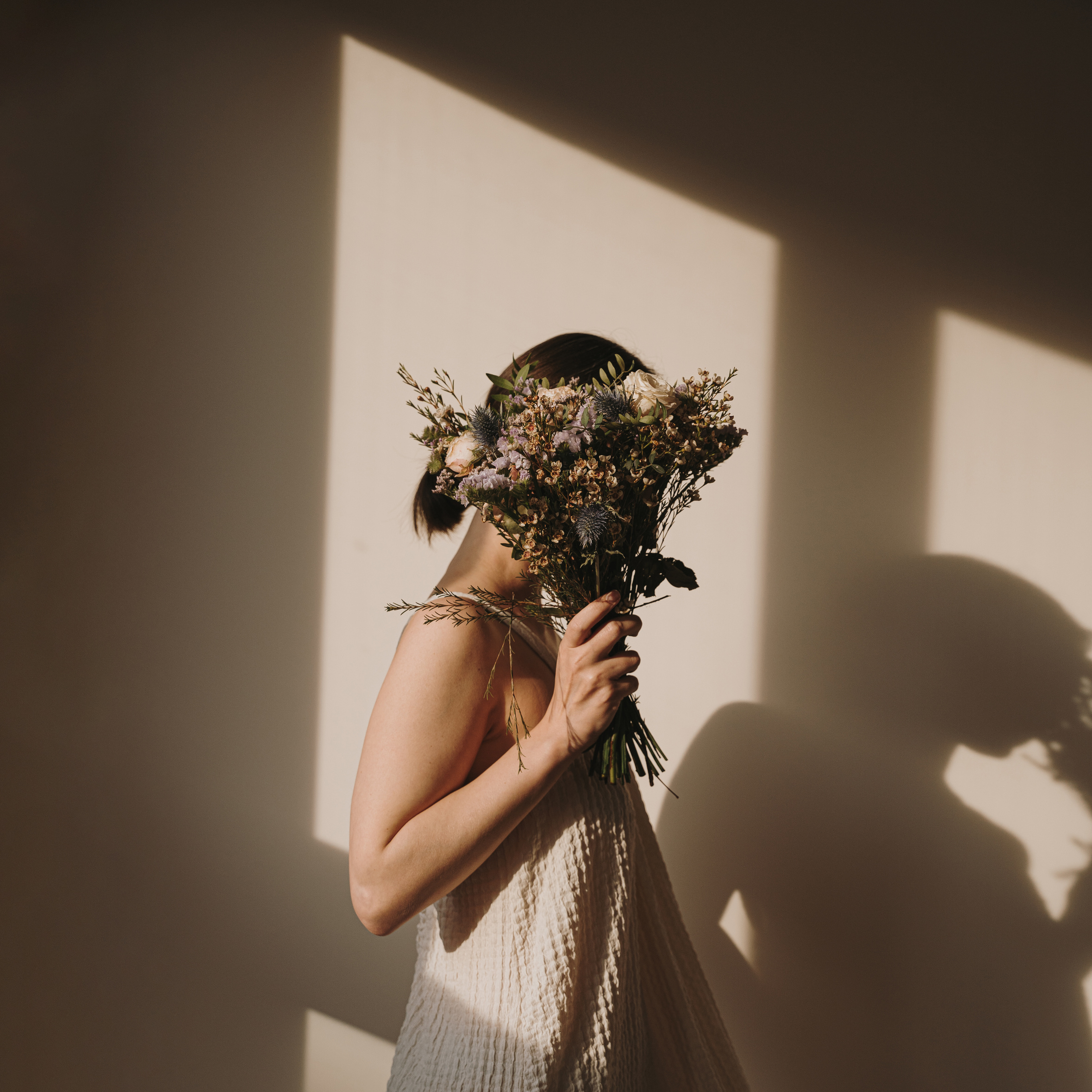 Woman Holding Bouquet of Wildflowers